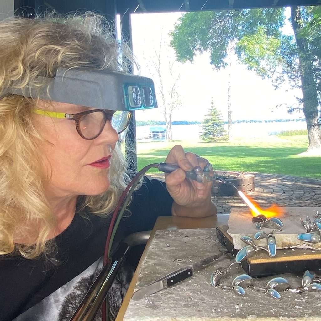 Fox in action as she creates one of her signature necklaces.